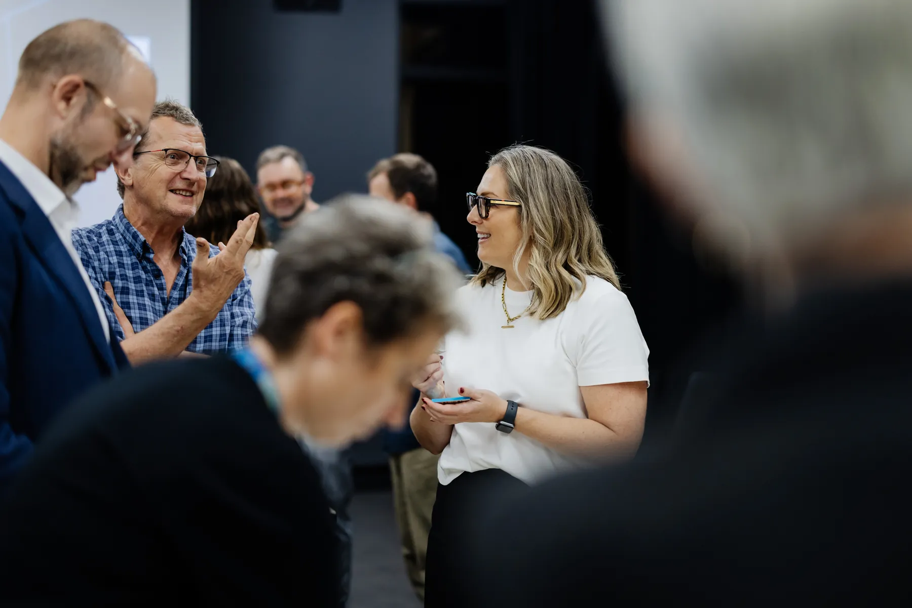 Attendees making new connections in the Transport and Mobility room at the salon.