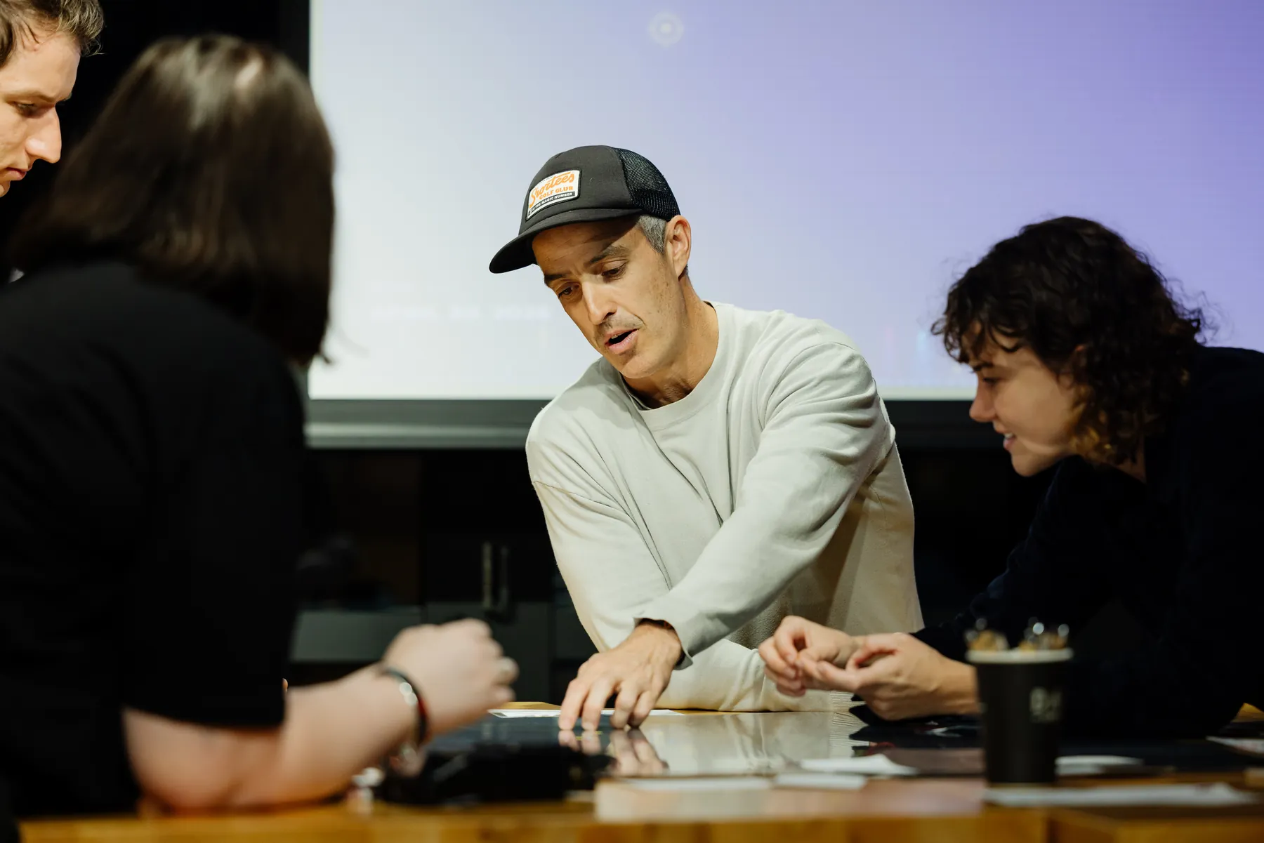 A subject-matter expert sharing ideas with a small group in the Night Culture and Economy room.