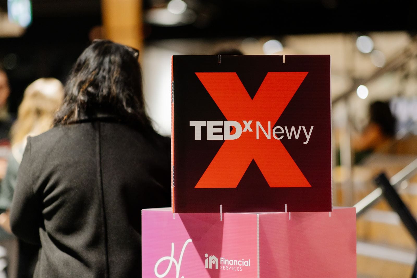 TEDxNewy event signage in the venue, hosted by TEDxNewy and Newcastle community partners.