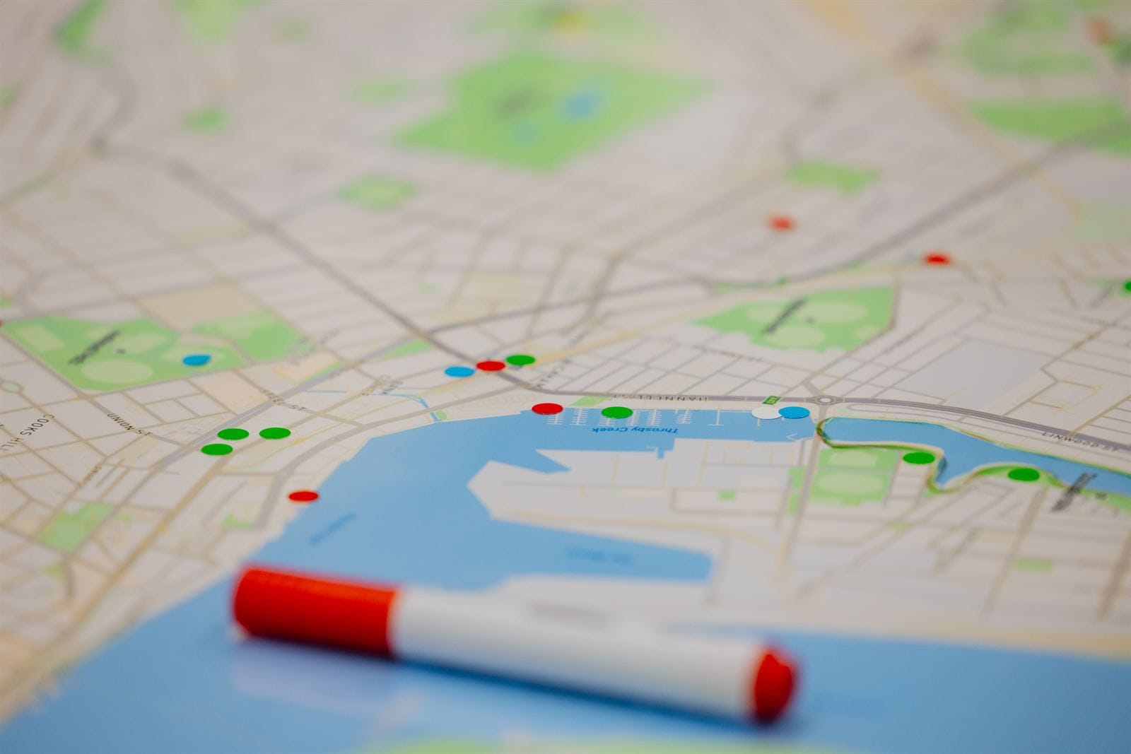 Map of Newcastle marked with colored pins, representing a local challenge to be tackled by student teams.