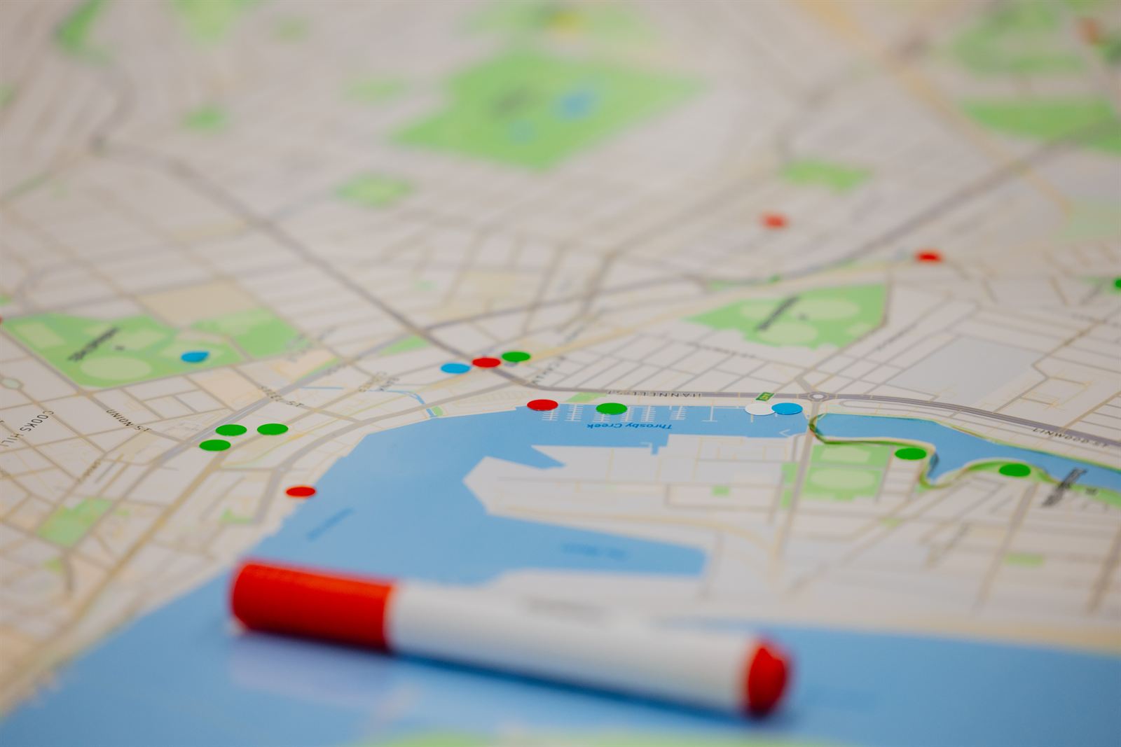 Map of Newcastle marked with colored pins, representing a local challenge to be tackled by student teams.